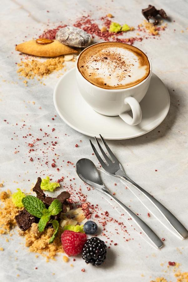 Asiana Grand Hotel Dubai Luaran gambar A coffee cup with a saucer